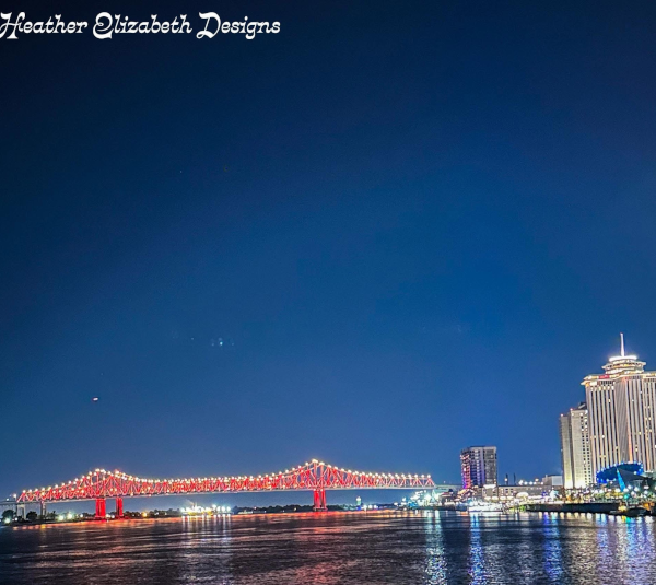 Crescent City Connection bridge illuminated in German Flag colors